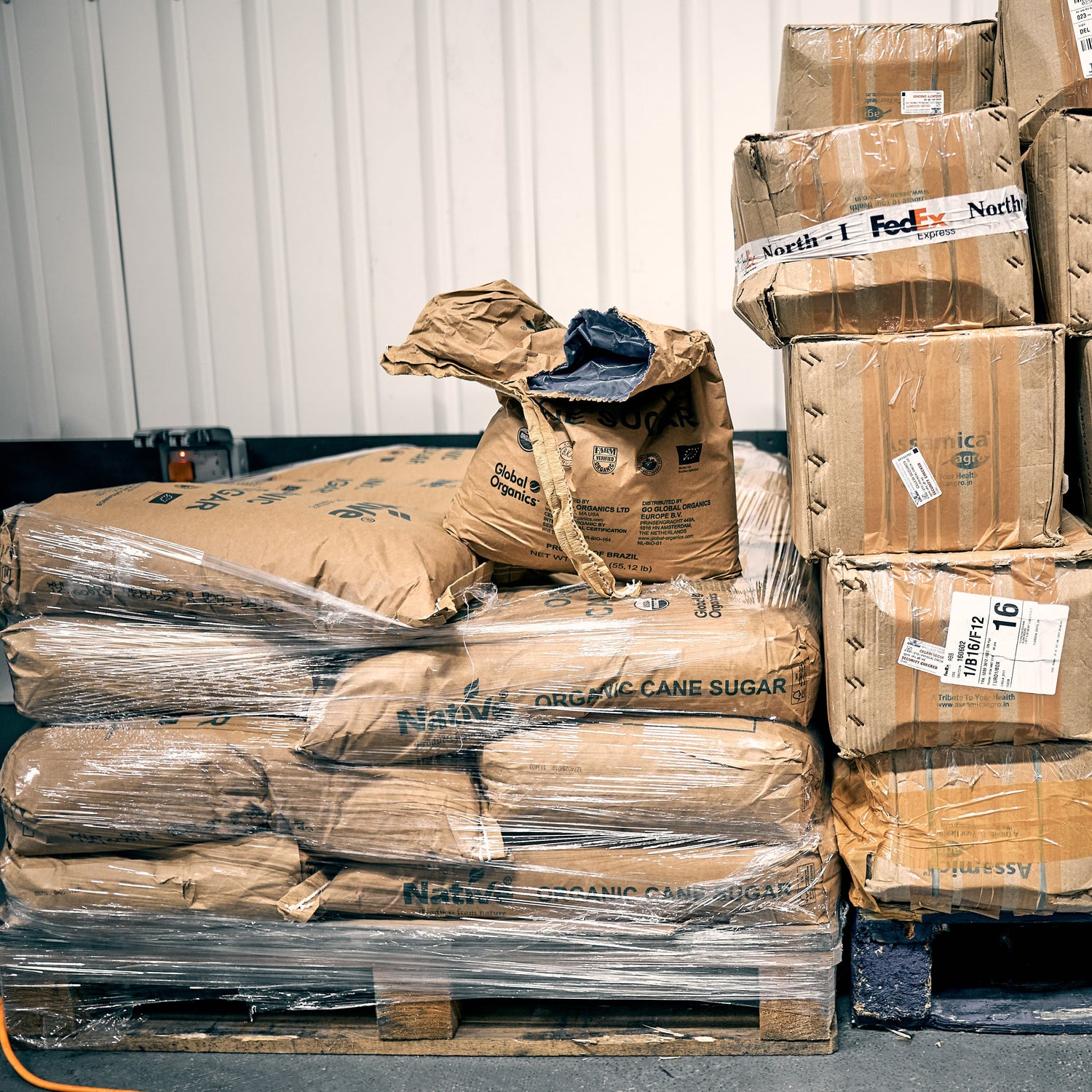 Stack of cardboard boxes containing ingredients