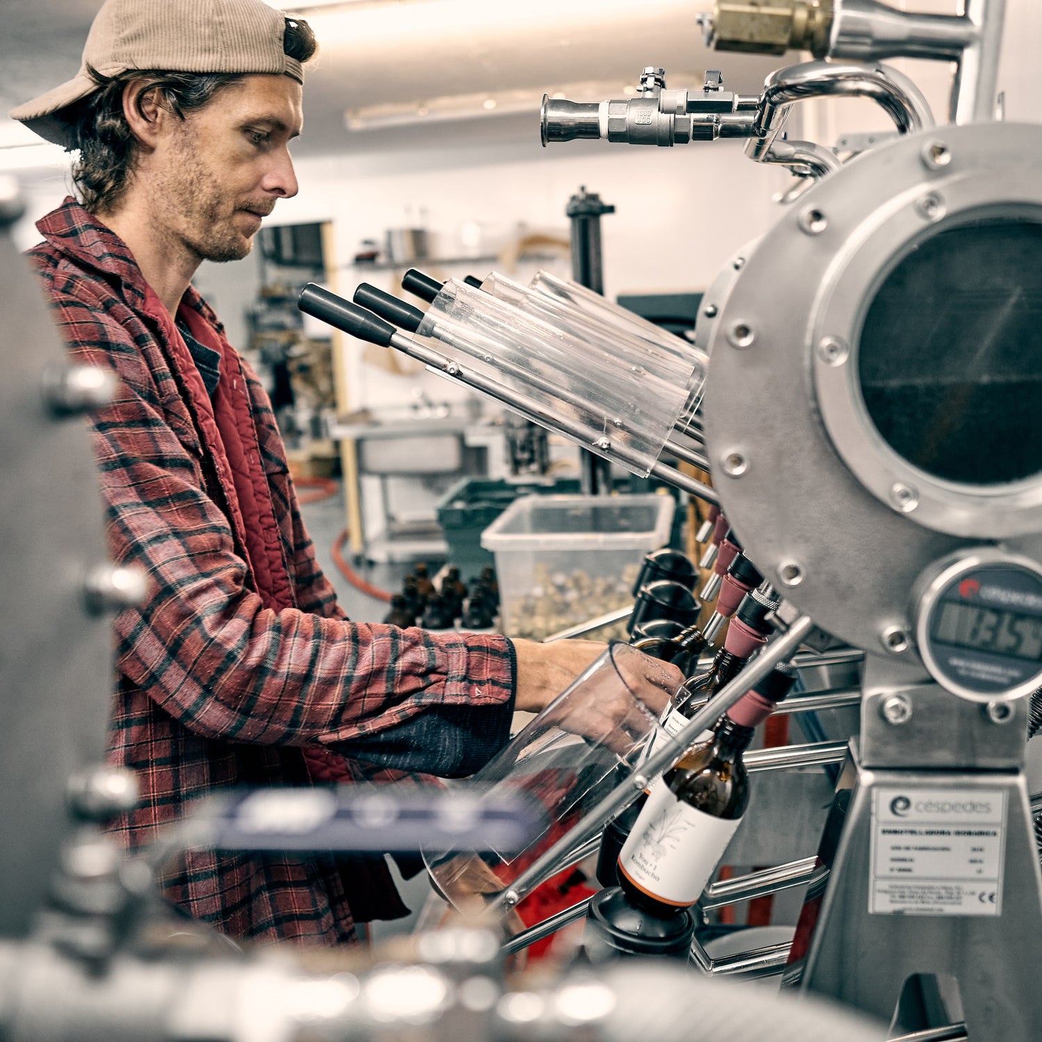 Person operating machinery in a brewery setting