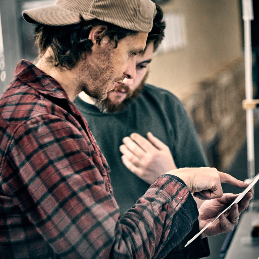 Checking brewing records on a tablet at the You + I brewery