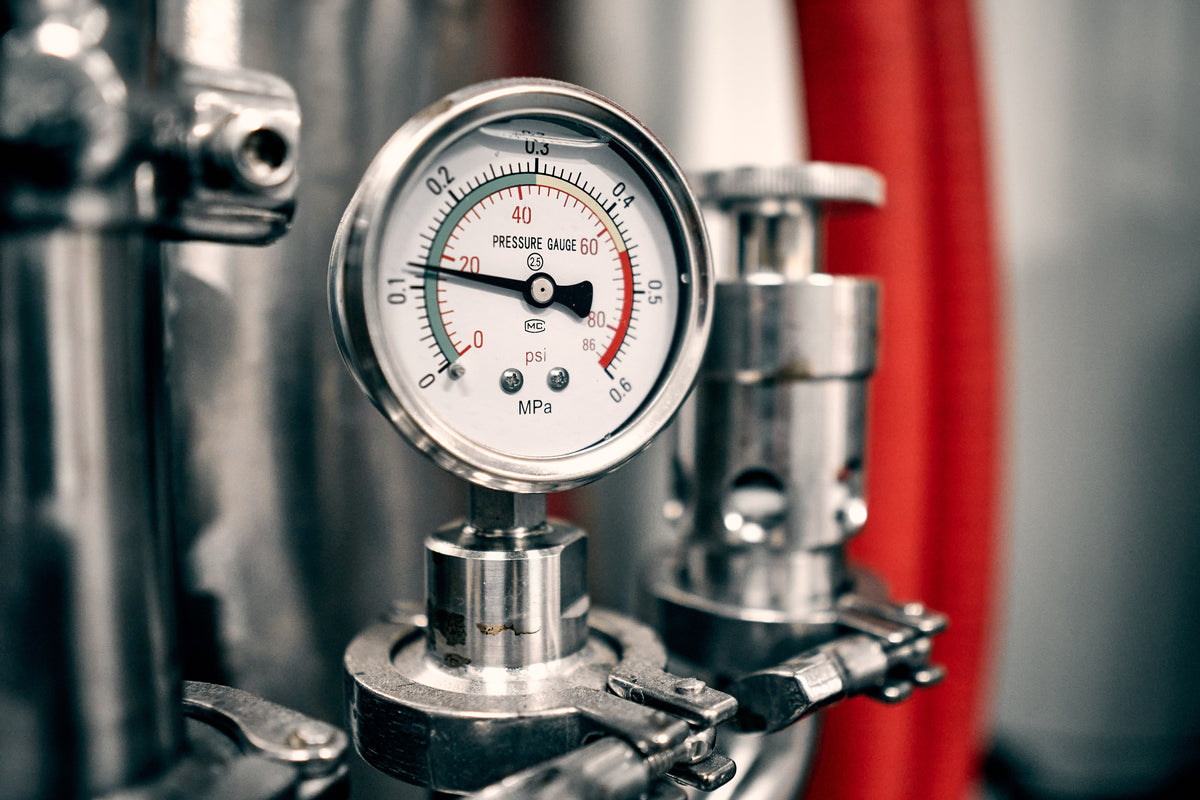 Pressure gauge on a stainless steel brewing tank at the You + I brewery